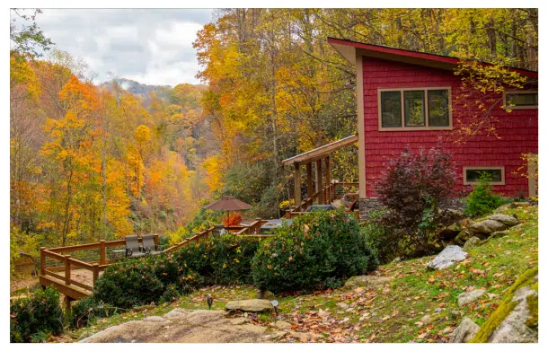 fall foliage Blue Ridge Mountains cabin at windows over waterfalls