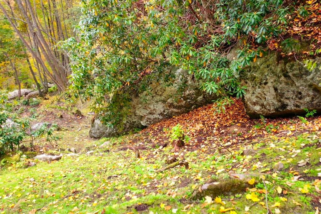 drone big falls looking down path Peaceful creekside retreat with natural rock formations and forest scenery in Western North Carolina