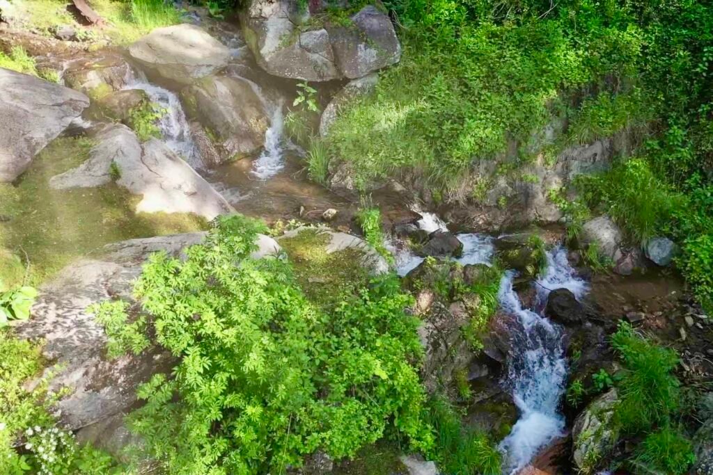drone upper cascades looking up Cozy mountain vacation rental near Max Patch with private creek and waterfall setting