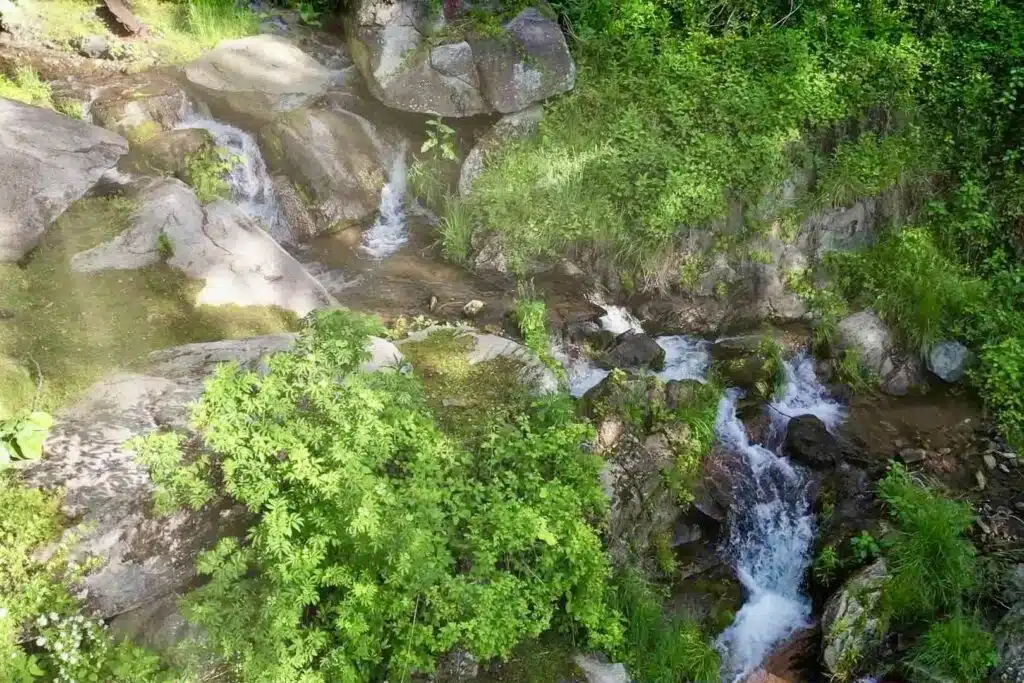 drone upper cascades looking up Cozy mountain vacation rental near Max Patch with private creek and waterfall setting