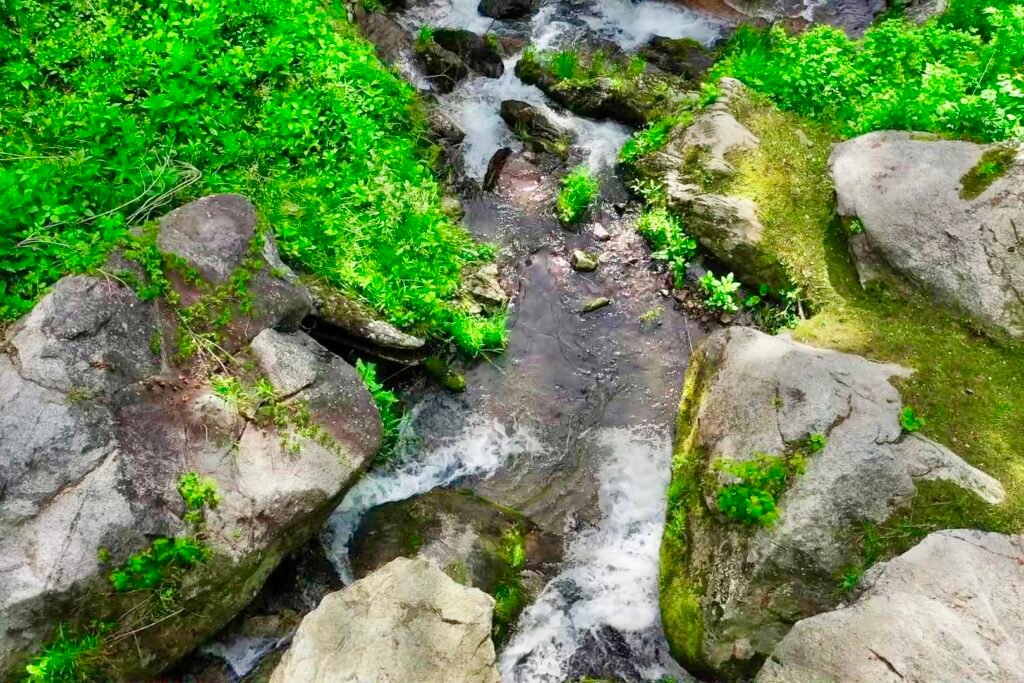 dronen flat rock looking straight down Waterfall and forest stream at Windows Over Waterfalls secluded cabin vacation rental in the mountains