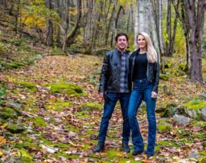 couple standing on mossy pathway at an inexpensive romantic getaways in nc 