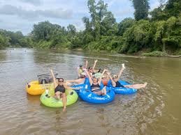 happy tubers doing French Broad River Tubing and Rafting near Hot Springs NC