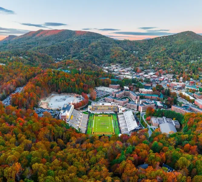 Fall in Boone NC — Linn Cove Viaduct on the Blue Ridge Parkway surrounded by crimson and gold fall foliage near Grandfather Mountain in October