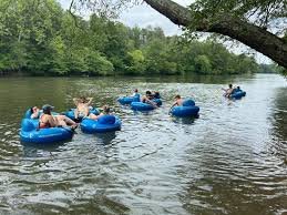 French Broad River tubing and rafting near Hot Springs NC with mountain views and summer water activities