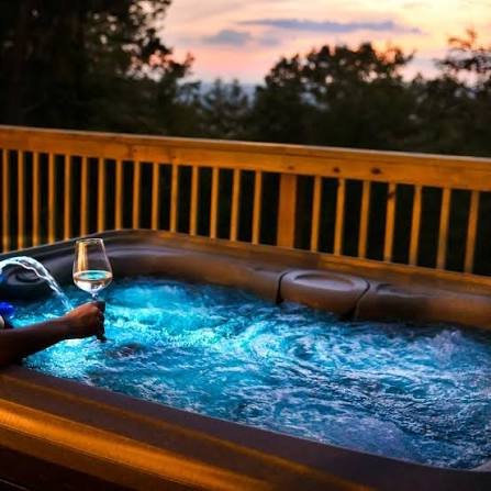 valentine's day getawayswith a Hot tub above the creek with lit waterfalls at Windows Over Waterfalls near Hot Springs NC
